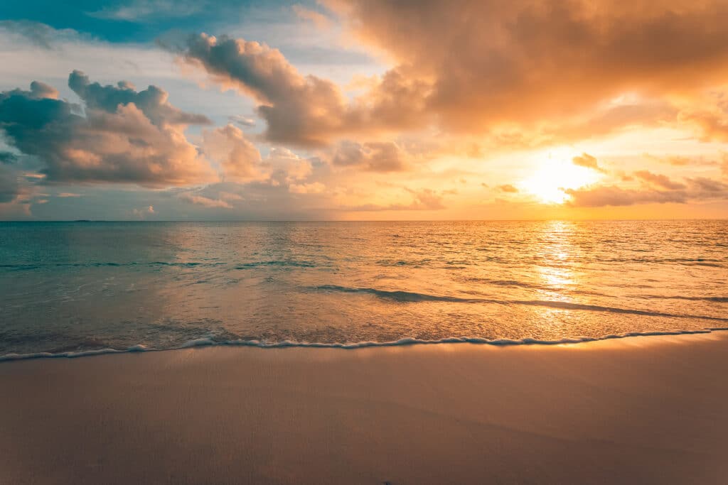 Closeup of sand on beach and blue summer sky by Tripps Plus